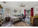 Spacious main bedroom with a ceiling fan, desk area, and a sliding glass door to the backyard at 5008 30Th Street E Ct, Bradenton, FL 34203