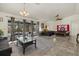 Spacious primary bedroom with screened lanai access, ceiling fan, and ample space for a seating area at 5008 30Th Street E Ct, Bradenton, FL 34203