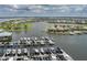 Community boat docks with lift provide direct water access in this coastal neighborhood with lush landscaping at 5040 Lake Overlook Ave, Bradenton, FL 34208