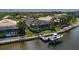 An aerial view showing waterfront homes complete with docks, lifts, screened pools, and lush landscaping at 5040 Lake Overlook Ave, Bradenton, FL 34208
