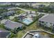 Aerial view of a community pool with a dock on the water at 5040 Lake Overlook Ave, Bradenton, FL 34208