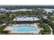 Aerial view of community pool and clubhouse overlooking the water at 5040 Lake Overlook Ave, Bradenton, FL 34208
