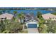 Waterfront property with tropical landscaping and view of marina at 5040 Lake Overlook Ave, Bradenton, FL 34208