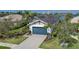 Aerial view showcasing the property's well-maintained lawn, landscaping, and appealing architectural design at 5040 Lake Overlook Ave, Bradenton, FL 34208