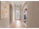 Bright foyer with arched doorways and tiled flooring at 5040 Lake Overlook Ave, Bradenton, FL 34208