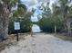 Tranquil community kayak launch with greenery and palm trees along the waters edge at 5040 Lake Overlook Ave, Bradenton, FL 34208
