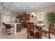 Kitchen with stainless steel appliances, wooden cabinets, and breakfast bar at 5040 Lake Overlook Ave, Bradenton, FL 34208