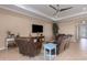 Living room with tile floors, crown molding, and recessed lighting at 5040 Lake Overlook Ave, Bradenton, FL 34208