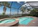 Screened-in pool and spa with waterfront views at 5040 Lake Overlook Ave, Bradenton, FL 34208
