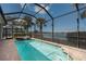 Screened pool boasts beautiful waterfront views, a heated spa, and ample space to enjoy the outdoors at 5040 Lake Overlook Ave, Bradenton, FL 34208