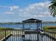 Peaceful waterfront view of waterway with dock and boat lift at 5040 Lake Overlook Ave, Bradenton, FL 34208