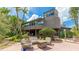 Spacious backyard featuring a patio with stylish furniture, a built-in hot tub, and beautiful landscaping at 5135 Riverwood Ave, Sarasota, FL 34231