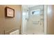 Modern walk-in shower with white stone flooring at 5135 Riverwood Ave, Sarasota, FL 34231