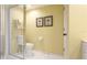Bright and clean bathroom featuring a walk-in shower, toilet, and yellow walls at 5135 Riverwood Ave, Sarasota, FL 34231