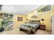 Comfortable bedroom featuring a ceiling fan, large bed, and natural light at 5135 Riverwood Ave, Sarasota, FL 34231