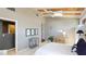 This bedroom features a wood plank ceiling, white tile floor, built-in shelving and recessed lighting at 5135 Riverwood Ave, Sarasota, FL 34231
