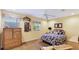 Cozy bedroom with sunny yellow walls, complemented by natural bamboo furniture at 5135 Riverwood Ave, Sarasota, FL 34231