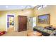 Spacious bedroom with twin beds, large painting, and high ceilings at 5135 Riverwood Ave, Sarasota, FL 34231