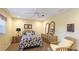 Charming bedroom with decor, two mirrors, bamboo night stands, and a ceiling fan at 5135 Riverwood Ave, Sarasota, FL 34231