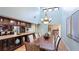Elegant dining room with seating for eight, a service bar, and tile flooring at 5135 Riverwood Ave, Sarasota, FL 34231