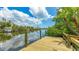 Waterfront home featuring a private dock with beautiful canal and water views at 5135 Riverwood Ave, Sarasota, FL 34231