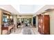 Bright entryway with skylights, terra-cotta flooring, and a decorative mirror at 5135 Riverwood Ave, Sarasota, FL 34231