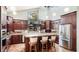 Kitchen with custom cabinets, granite countertops, and stainless steel appliances at 5135 Riverwood Ave, Sarasota, FL 34231