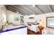 Bright kitchen featuring white cabinets, tile countertops, wood floors, and an open layout perfect for cooking at 5135 Riverwood Ave, Sarasota, FL 34231