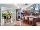 Eat-in kitchen with stainless appliances, tile floor, kitchen island with barstool seating and bright breakfast nook at 5135 Riverwood Ave, Sarasota, FL 34231