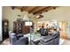 Inviting living room with beam ceiling, tile floors, and comfortable seating at 5135 Riverwood Ave, Sarasota, FL 34231
