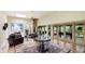 Cozy living room with fireplace, tile floors, plush furniture, and a view of the lanai at 5135 Riverwood Ave, Sarasota, FL 34231