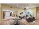 Spacious living room with terra-cotta floors, neutral walls, skylight and fireplace at 5135 Riverwood Ave, Sarasota, FL 34231
