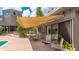 Outdoor patio with retractable awning for shade, dining set, outdoor seating, and a hot tub at 5135 Riverwood Ave, Sarasota, FL 34231
