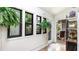 Sunroom with tiled floor, hanging plants, and an abundance of natural light at 5135 Riverwood Ave, Sarasota, FL 34231