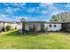 Lush backyard features a screened patio perfect for outdoor entertaining, with manicured lawn at 6124 Green View Dr # 139, Sarasota, FL 34231