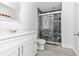 Bathroom featuring a shower with marble-look surround, white vanity, and modern fixtures at 6124 Green View Dr # 139, Sarasota, FL 34231