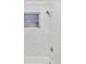 Bright bathroom featuring a marble-tiled shower, window, and modern fixtures at 6124 Green View Dr # 139, Sarasota, FL 34231