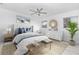Relaxing bedroom featuring a decorative ceiling fan, ample natural light and stylish decor at 6124 Green View Dr # 139, Sarasota, FL 34231