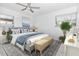 Cozy bedroom with ceiling fan, large bed and bright, natural light at 6124 Green View Dr # 139, Sarasota, FL 34231