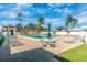 Community pool featuring an expansive pool deck, comfortable lounge chairs, and plenty of shade at 6124 Green View Dr # 139, Sarasota, FL 34231
