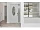 Bright entryway featuring new flooring, a decorative door, and a window with blinds at 6124 Green View Dr # 139, Sarasota, FL 34231