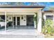 Image of the home's covered driveway with storage and the front entrance at 6124 Green View Dr # 139, Sarasota, FL 34231