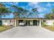 Inviting single-story home featuring a covered carport and a welcoming front yard at 6124 Green View Dr # 139, Sarasota, FL 34231