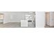 Open concept kitchen with white cabinets, stainless appliances, and breakfast bar with quartz countertops at 6124 Green View Dr # 139, Sarasota, FL 34231