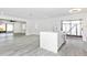 Bright kitchen with island, stainless steel appliances, and adjacent living space at 6124 Green View Dr # 139, Sarasota, FL 34231