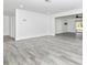 Large living area featuring updated flooring, neutral color palette, and access to outdoor space at 6124 Green View Dr # 139, Sarasota, FL 34231