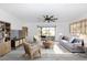 Bright living room with modern furnishings and sliding glass doors at 6124 Green View Dr # 139, Sarasota, FL 34231