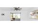 Open living space featuring modern ceiling fan, sliding glass door and a window with natural light at 6124 Green View Dr # 139, Sarasota, FL 34231