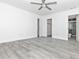 Main bedroom with wood floors that leads to an ensuite bathroom at 6124 Green View Dr # 139, Sarasota, FL 34231