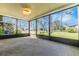 Enclosed lanai showcasing outdoor views of the backyard and lush greenery at 6124 Green View Dr # 139, Sarasota, FL 34231